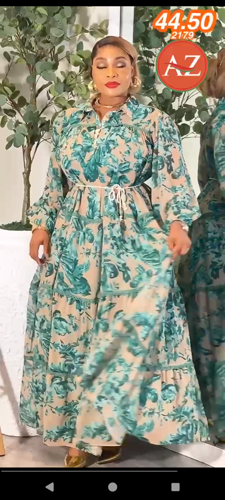 This is a green and beige floral print mixi dress from Baltic Bon